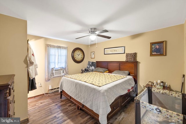 bedroom featuring cooling unit, ceiling fan, baseboard heating, and dark hardwood / wood-style flooring