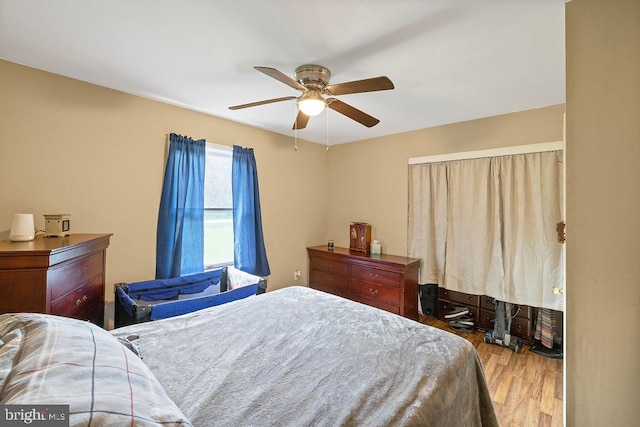 bedroom featuring light hardwood / wood-style flooring and ceiling fan