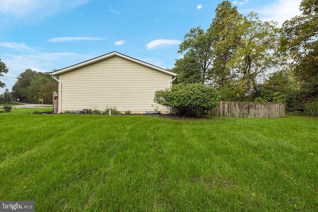 view of property exterior featuring a yard