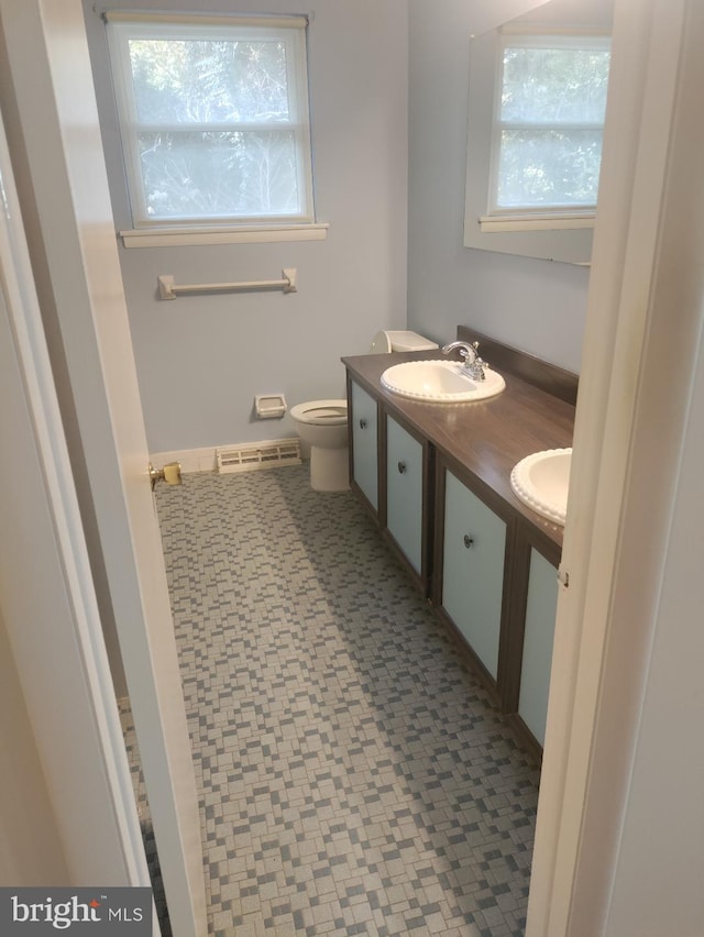 bathroom with vanity and toilet