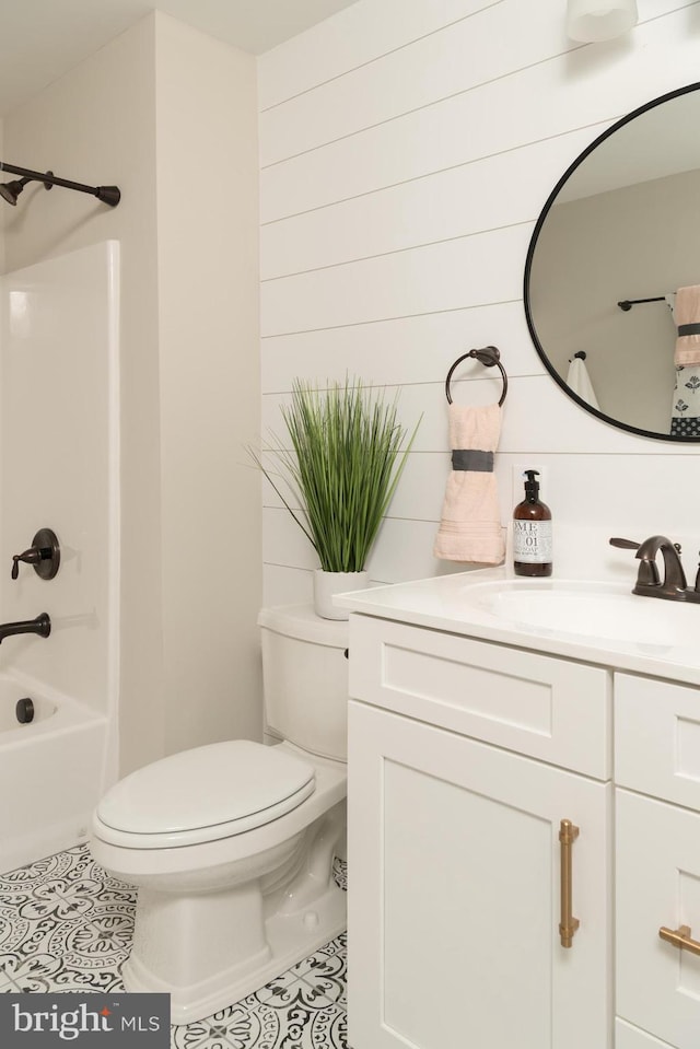 full bathroom with vanity, shower / bath combination, tile patterned flooring, and toilet