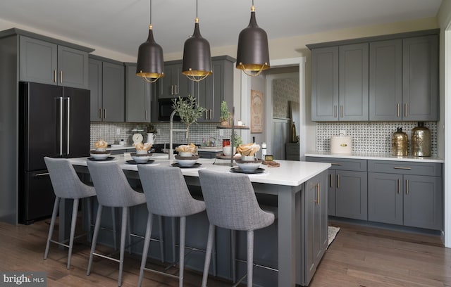 kitchen featuring gray cabinets and high quality fridge