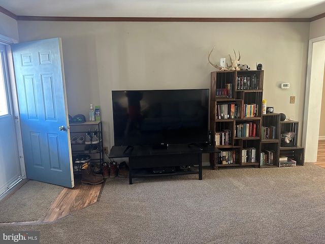 living room with ornamental molding and hardwood / wood-style floors