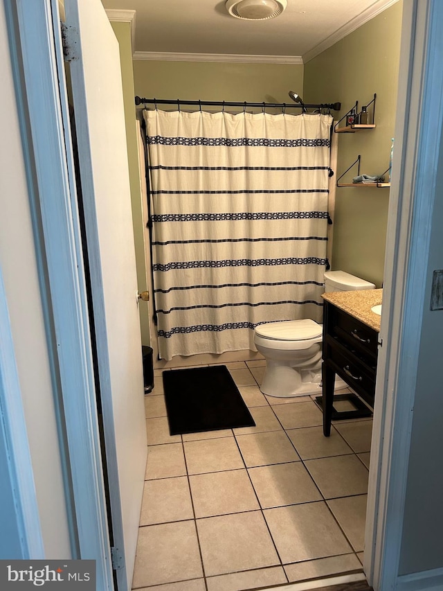 bathroom with vanity, tile patterned floors, toilet, and ornamental molding