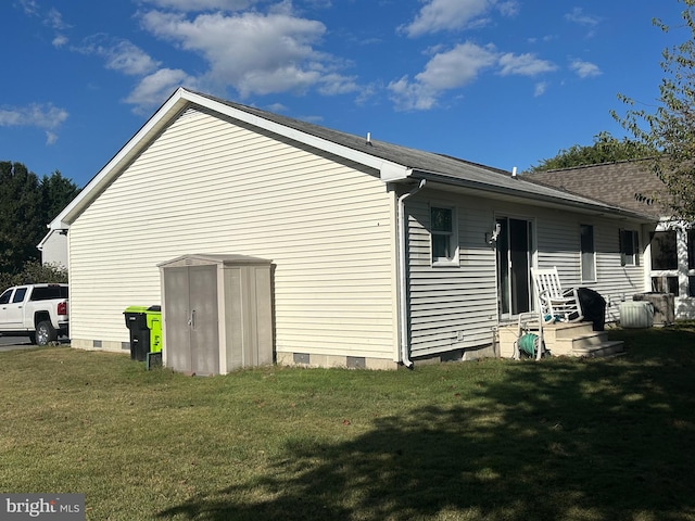 view of side of home with a lawn