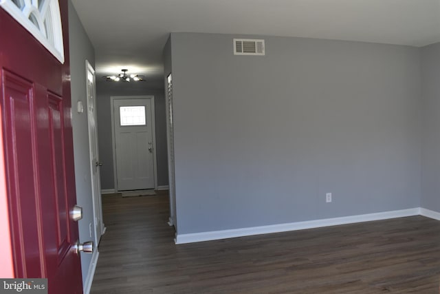 foyer entrance with dark hardwood / wood-style flooring