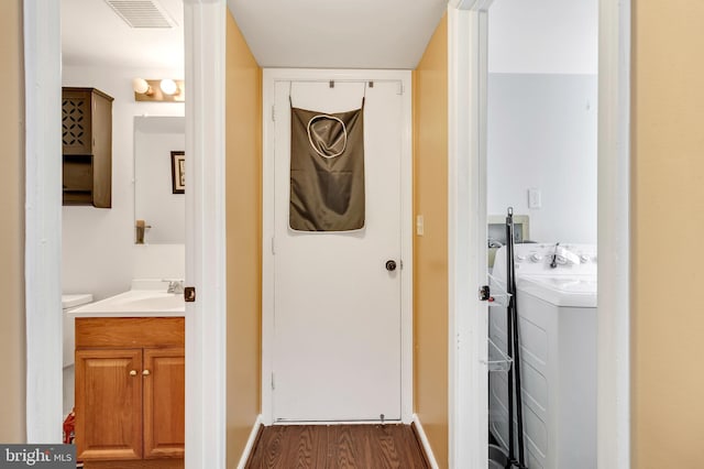 bathroom with hardwood / wood-style floors and vanity