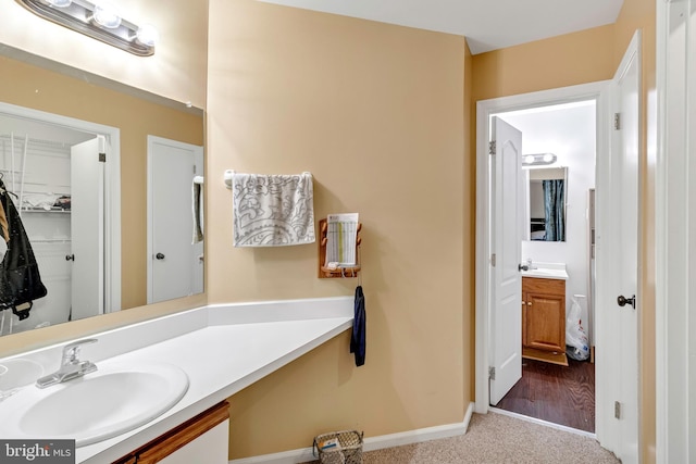 bathroom featuring vanity and hardwood / wood-style flooring