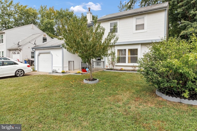 view of front of property featuring a garage and a front yard