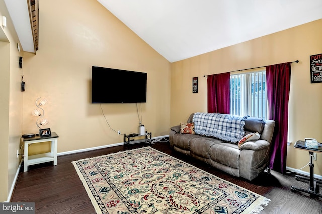 living room with high vaulted ceiling and dark hardwood / wood-style flooring