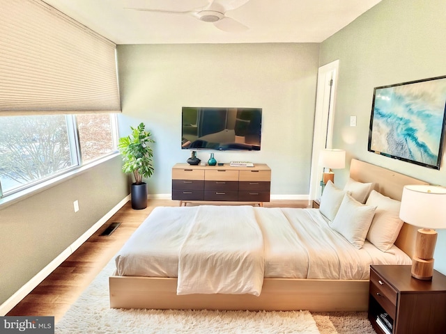 bedroom featuring ceiling fan and hardwood / wood-style flooring