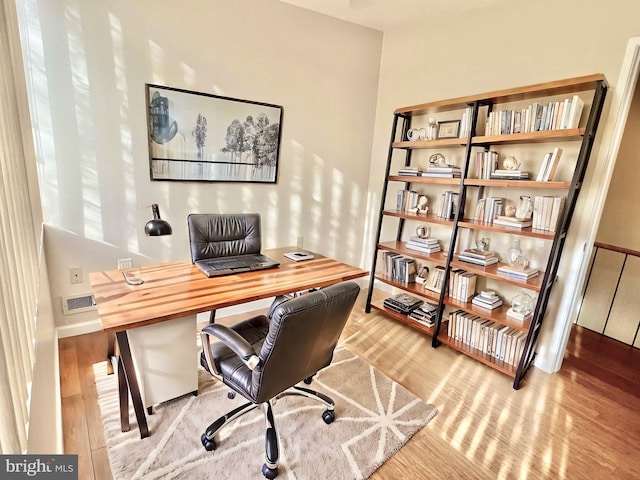 home office with light wood-type flooring