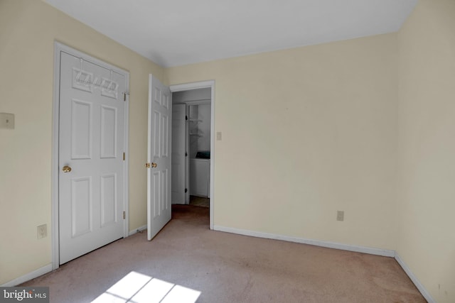 unfurnished bedroom with light colored carpet