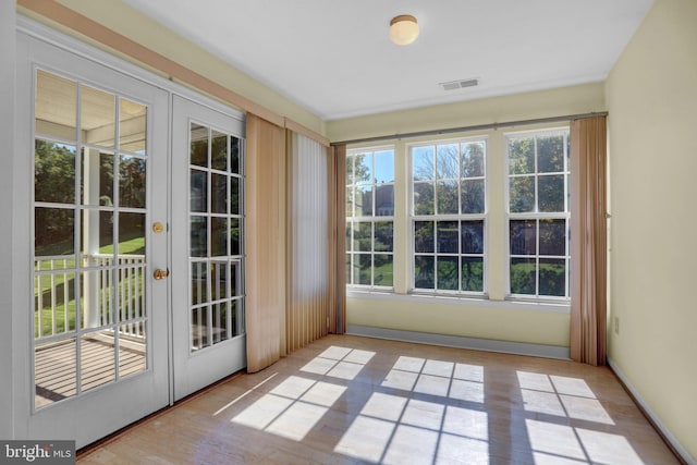 interior space with french doors and light wood-type flooring