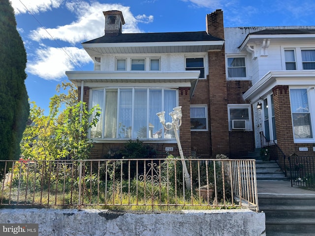 view of front of home featuring cooling unit