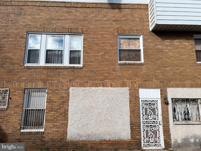view of home's exterior with brick siding