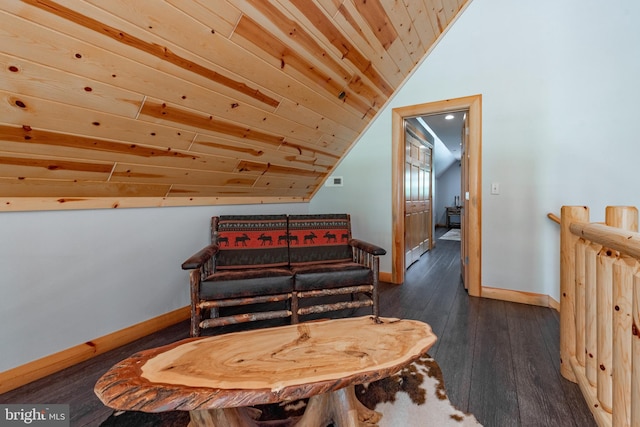 living area featuring dark hardwood / wood-style flooring, lofted ceiling, and wood ceiling