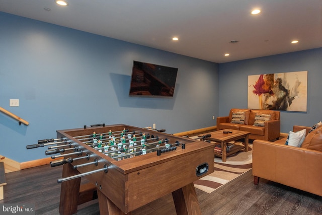 recreation room with dark wood-type flooring