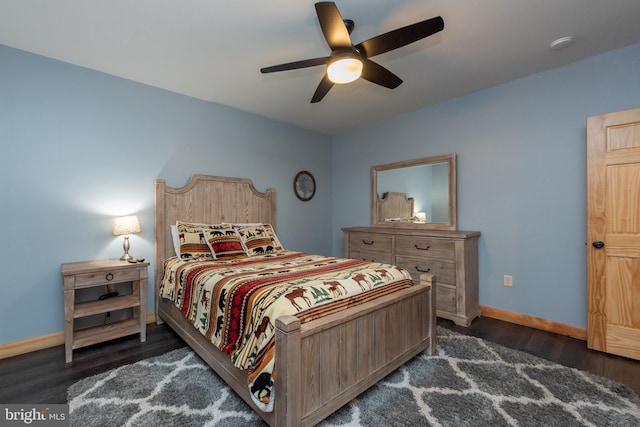 bedroom featuring ceiling fan and dark hardwood / wood-style flooring