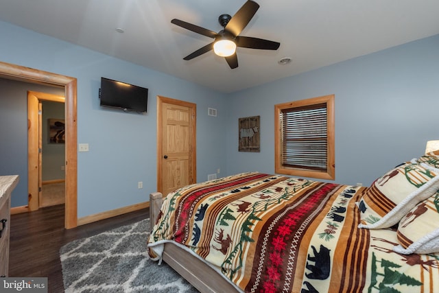 bedroom with ceiling fan and dark hardwood / wood-style flooring