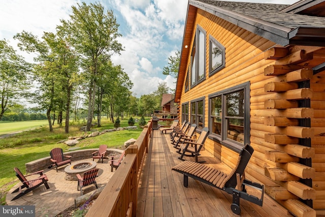 wooden deck with an outdoor fire pit