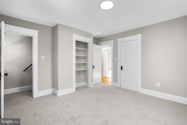 unfurnished bedroom with light carpet