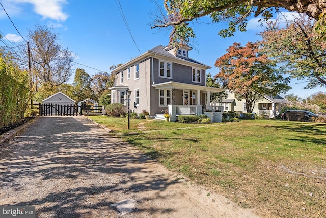 exterior space featuring a front lawn and covered porch