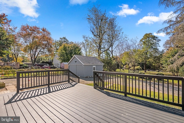 wooden deck featuring a storage unit