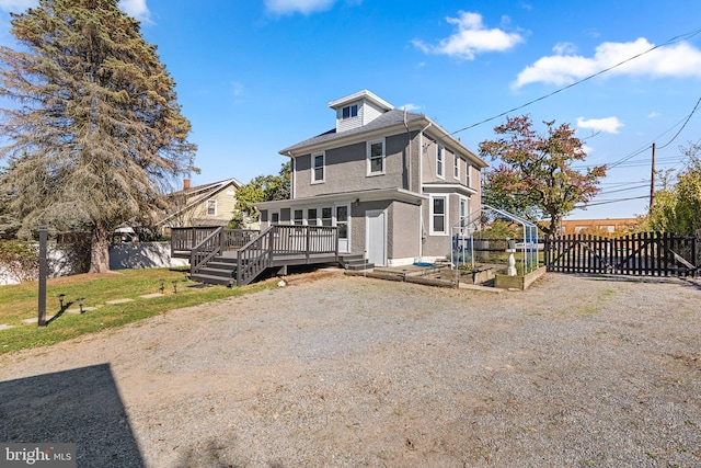 view of front property featuring a wooden deck