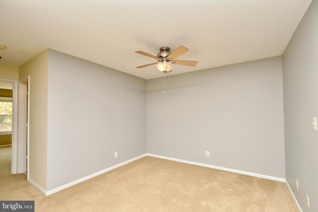 unfurnished room with light carpet and ceiling fan