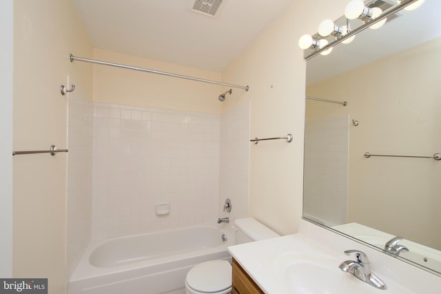 full bathroom with vanity, toilet, and tiled shower / bath combo