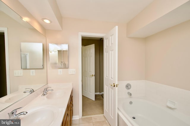 bathroom featuring vanity, a tub to relax in, and tile patterned flooring