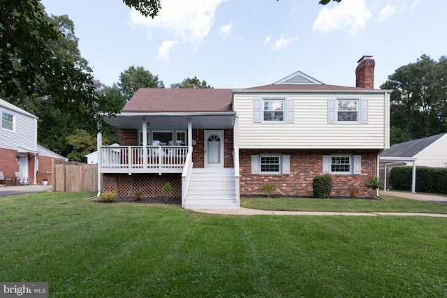 split level home featuring a front lawn