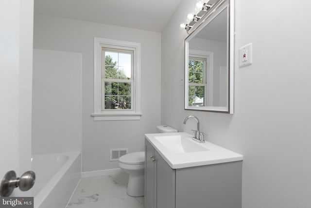 bathroom featuring vanity and toilet