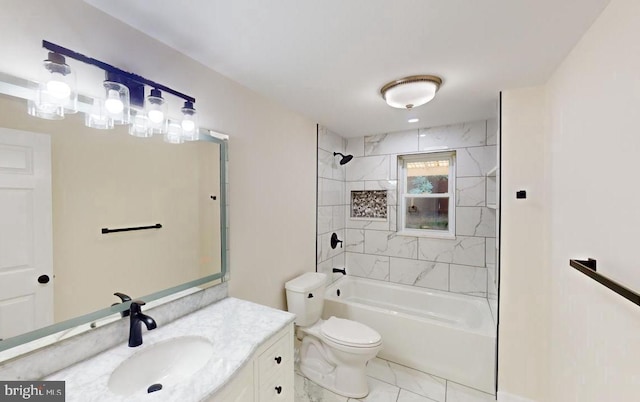 full bathroom featuring tiled shower / bath, vanity, and toilet