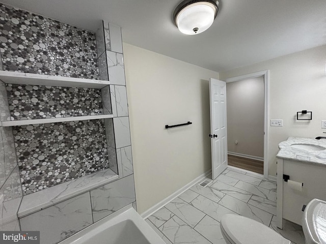 bathroom with toilet, vanity, and a washtub