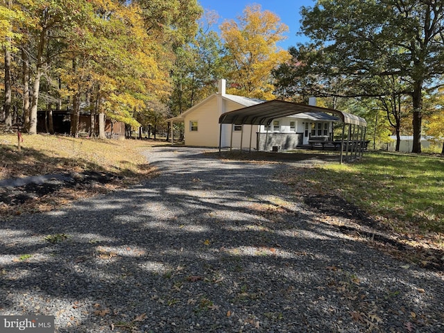 view of property exterior featuring a carport