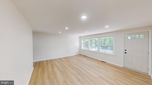 foyer with light wood-type flooring