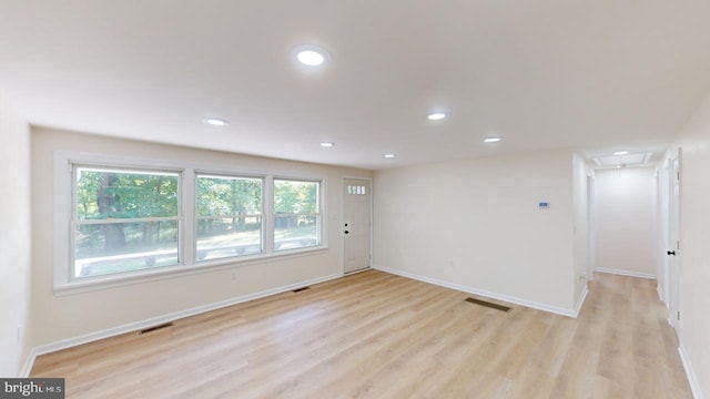 unfurnished room with light hardwood / wood-style floors