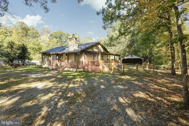 view of front of house with an outdoor structure