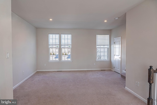 spare room with light colored carpet