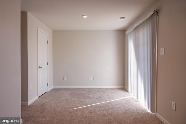 empty room featuring carpet floors