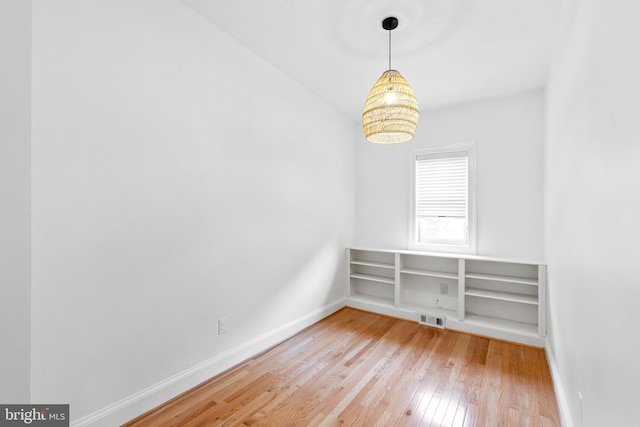 spare room featuring light wood-type flooring