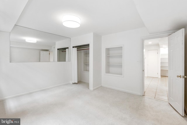 unfurnished bedroom with light colored carpet