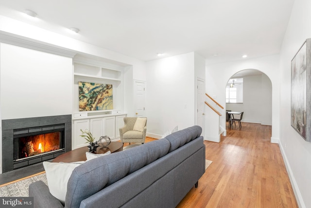 living room featuring light hardwood / wood-style floors and a fireplace