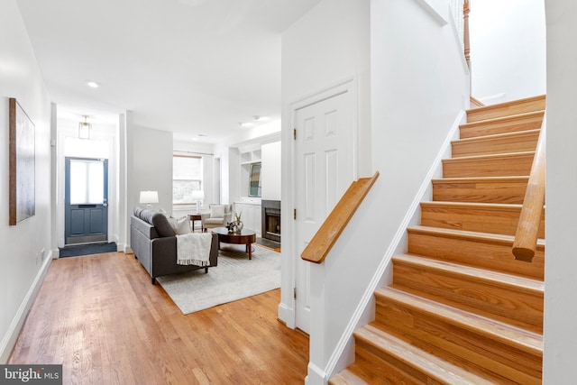 staircase featuring hardwood / wood-style flooring