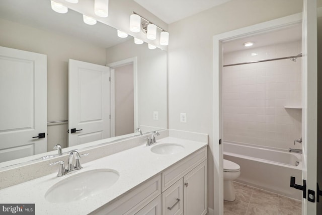 full bathroom featuring toilet, shower / tub combination, tile patterned flooring, and vanity