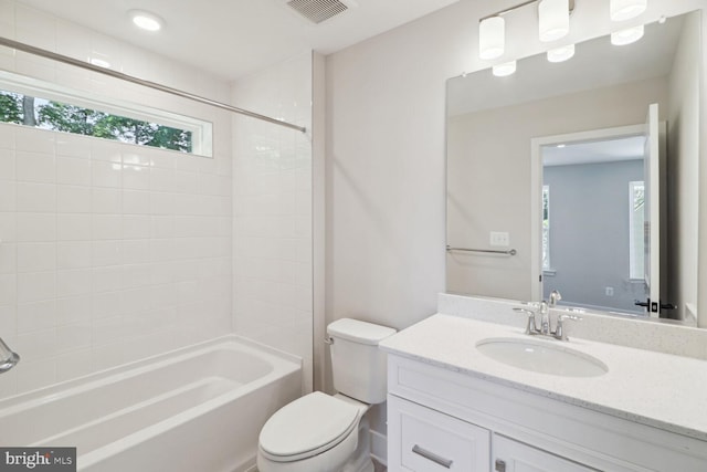 full bathroom with vanity, toilet, and shower / washtub combination