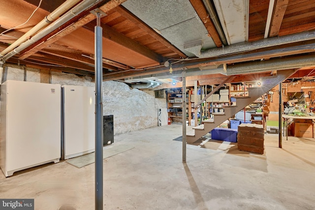 basement with white fridge