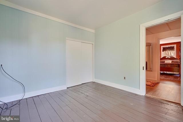 spare room with hardwood / wood-style floors